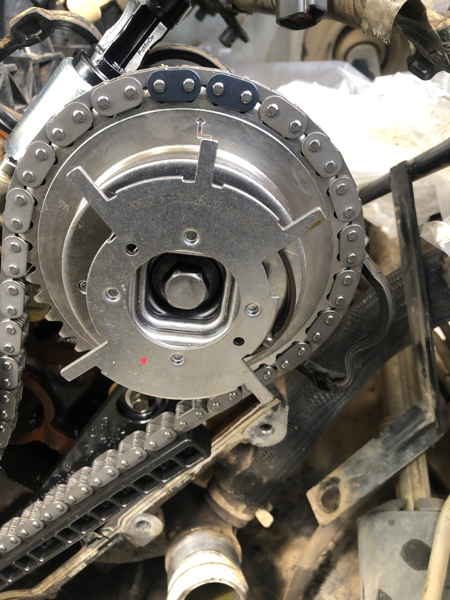 Close view of a timing chain component being serviced