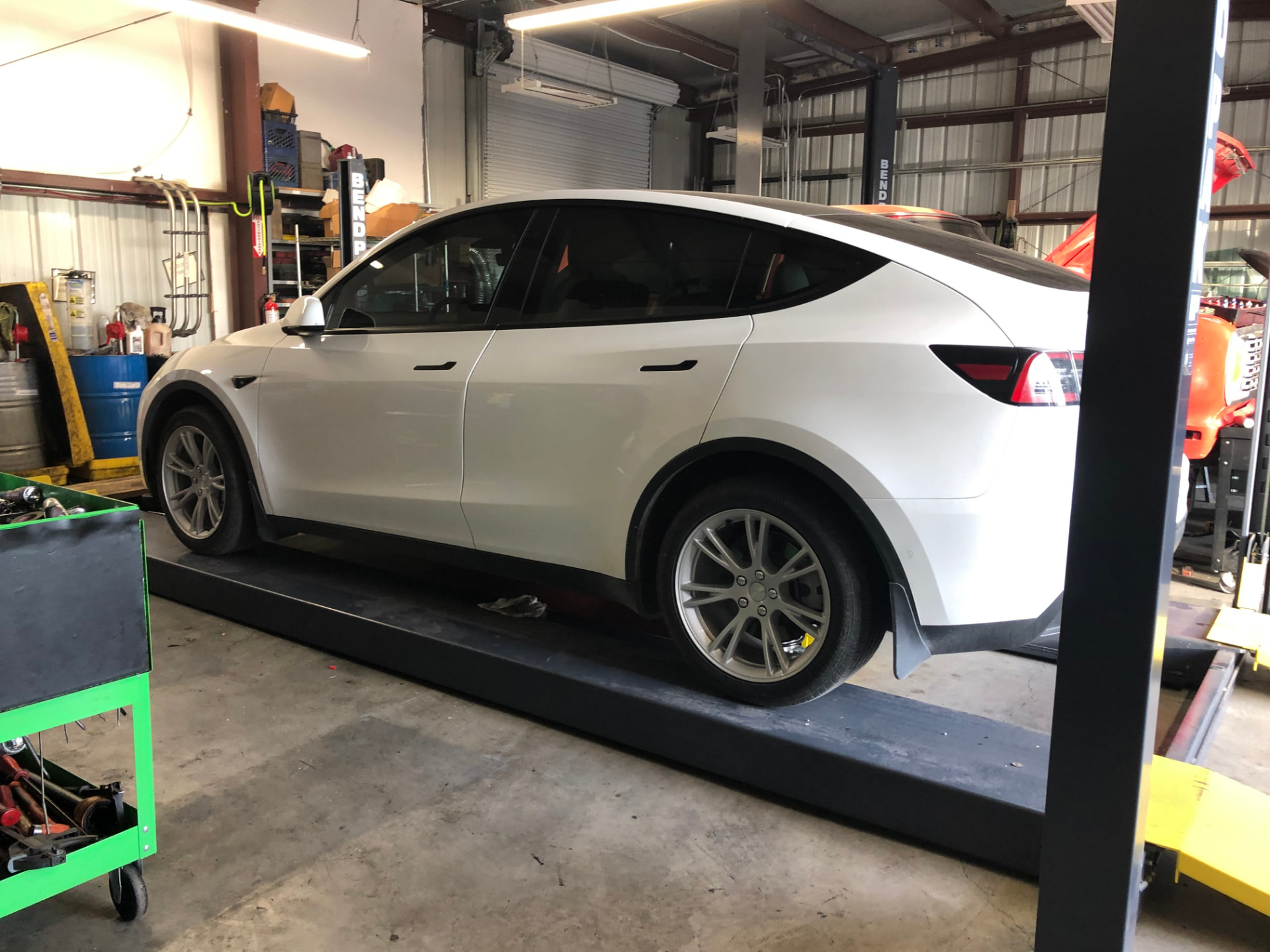 Electric vehicle in the Rodas Auto Repair service bay
