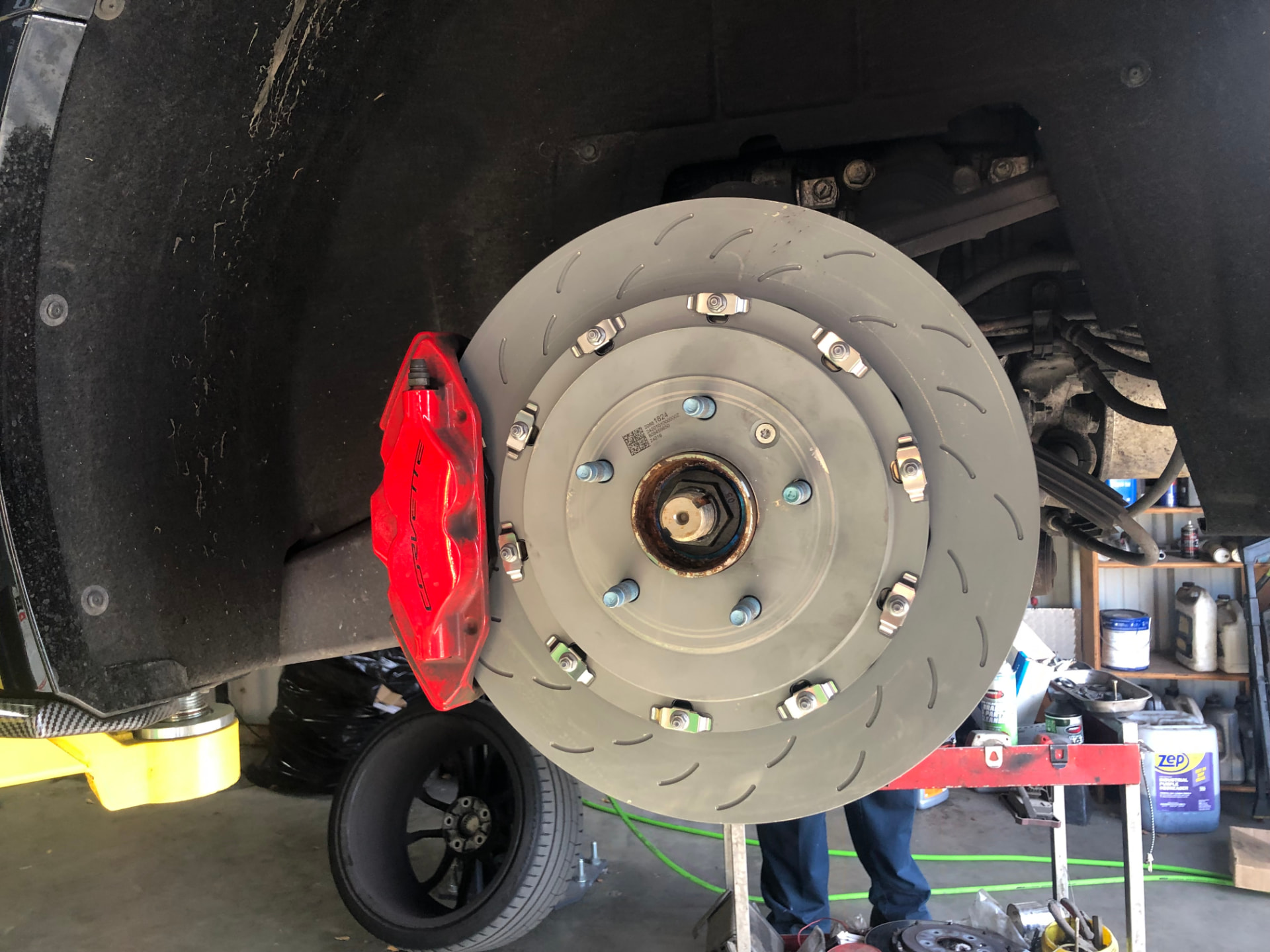 Rodas Auto Repair technician servicing a vehicle brake system